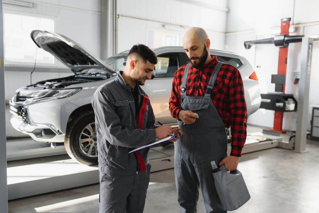 Vehicle technicians with tools