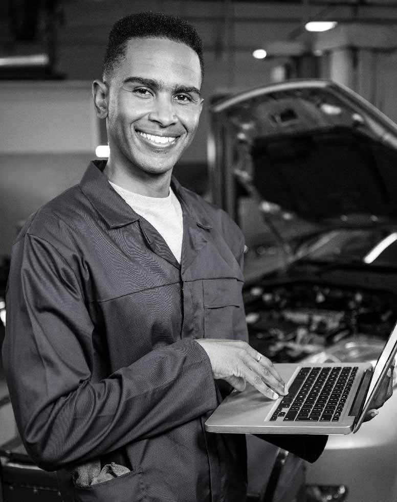Autotech-Training-MOT-Annual-Training-and-Assessment Autotech Technician working on a laptop
