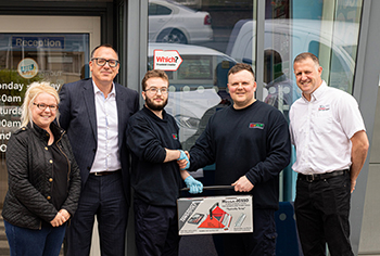 Ben Shaw, a young vehicle mechanic at In n Out Autocentres Ben Shaw receives a tool kit from Autotech Recruit and In n Out Autocentres