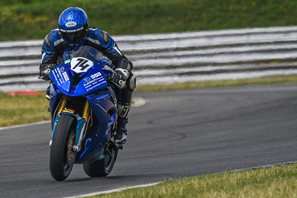 Joe Morphett No. 74 Joe Morphett racing on his bike with Autotech Recruit logo