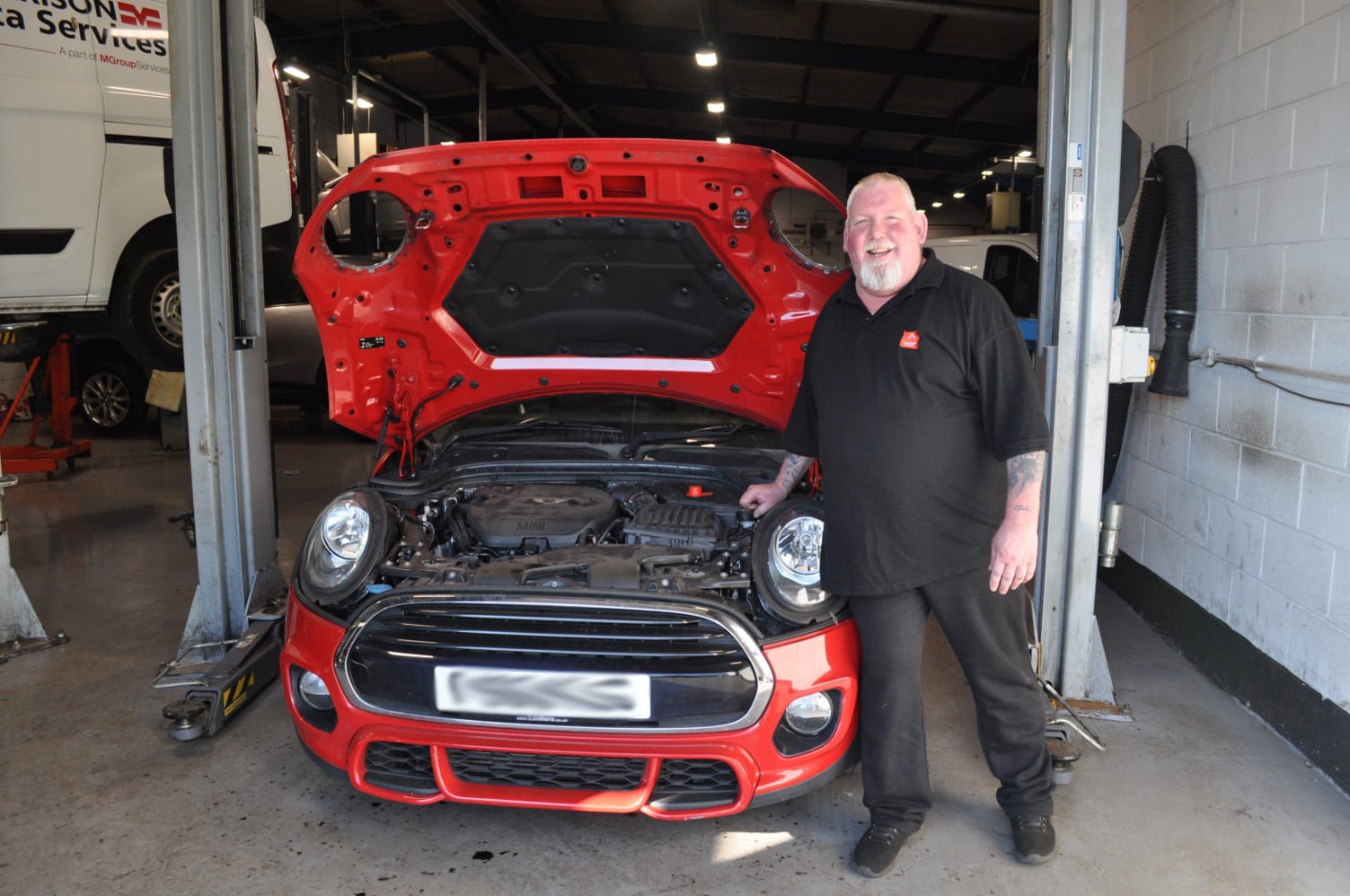 Image of Steven Britton standing in front of a car - Steven is one of our Contract Vehicle Technicians and Ambassador