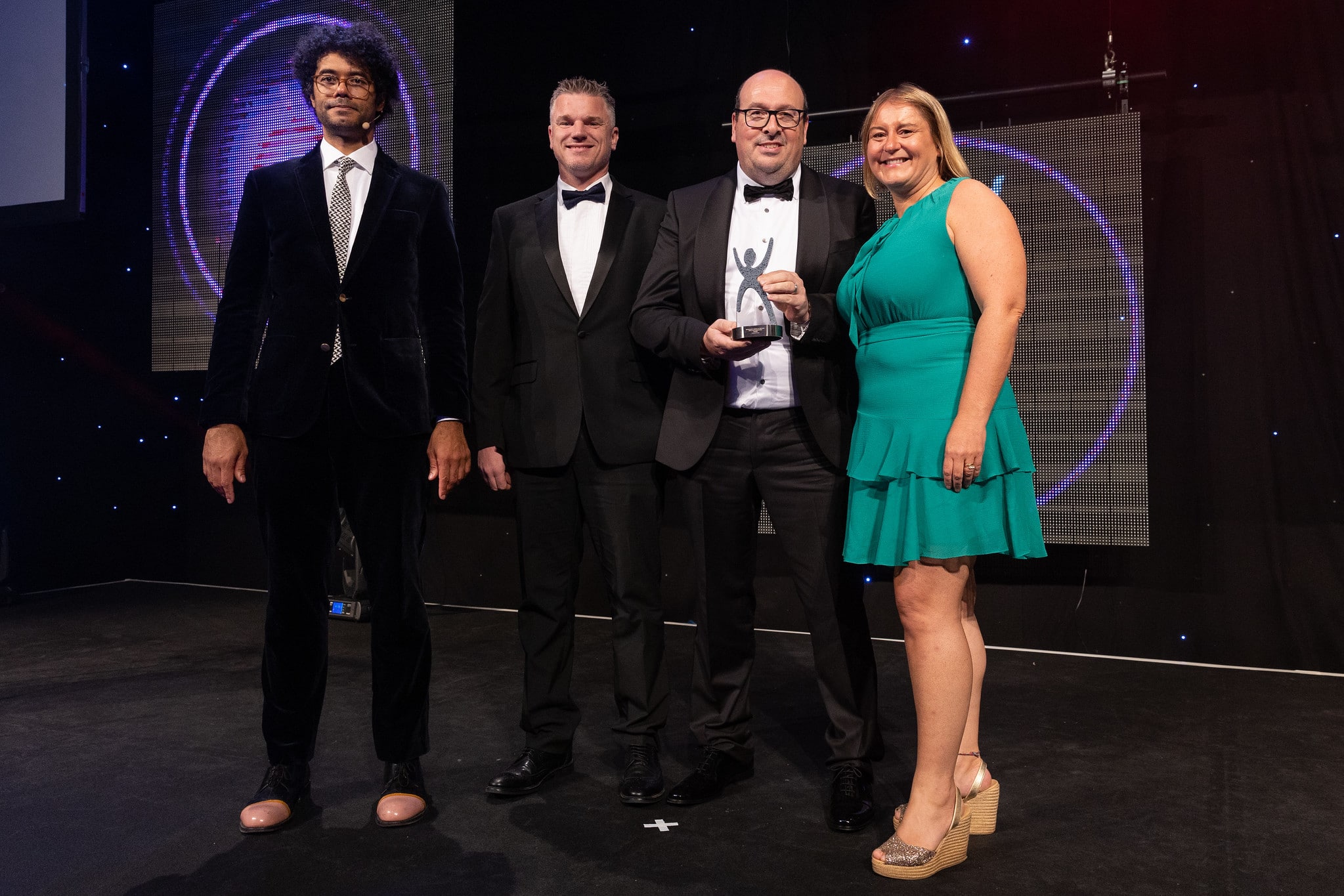 From left to right: presenter and comedian, Richard Ayoade; James Mackay, Group Sales Director for Autotech Group; Interim CEO, Simon King with the Recruiter magazine representative