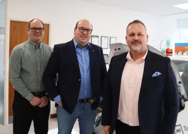 In this photo: Simon King, CEO of Autotech Group (centre), with Mark Armitage, Chief Revenue Officer, to his right, and Laurence Abbott, Chief Technology Officer, to his left.