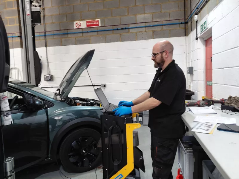 Automotive contractor working in workshop